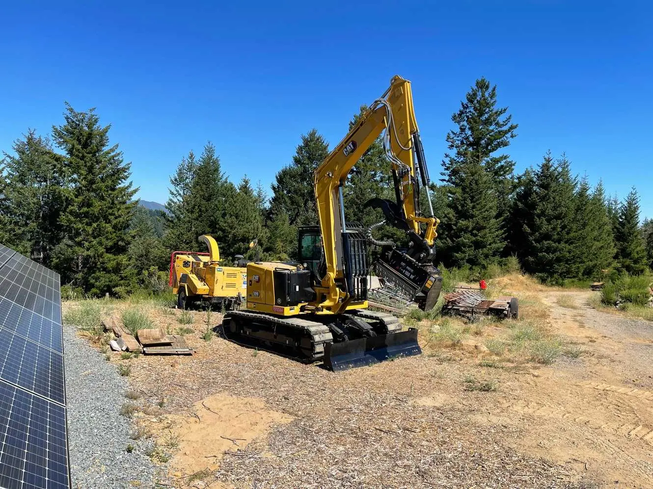 CAT excavator on mountain excavation project in Santa Cruz Mountains Bay Area California